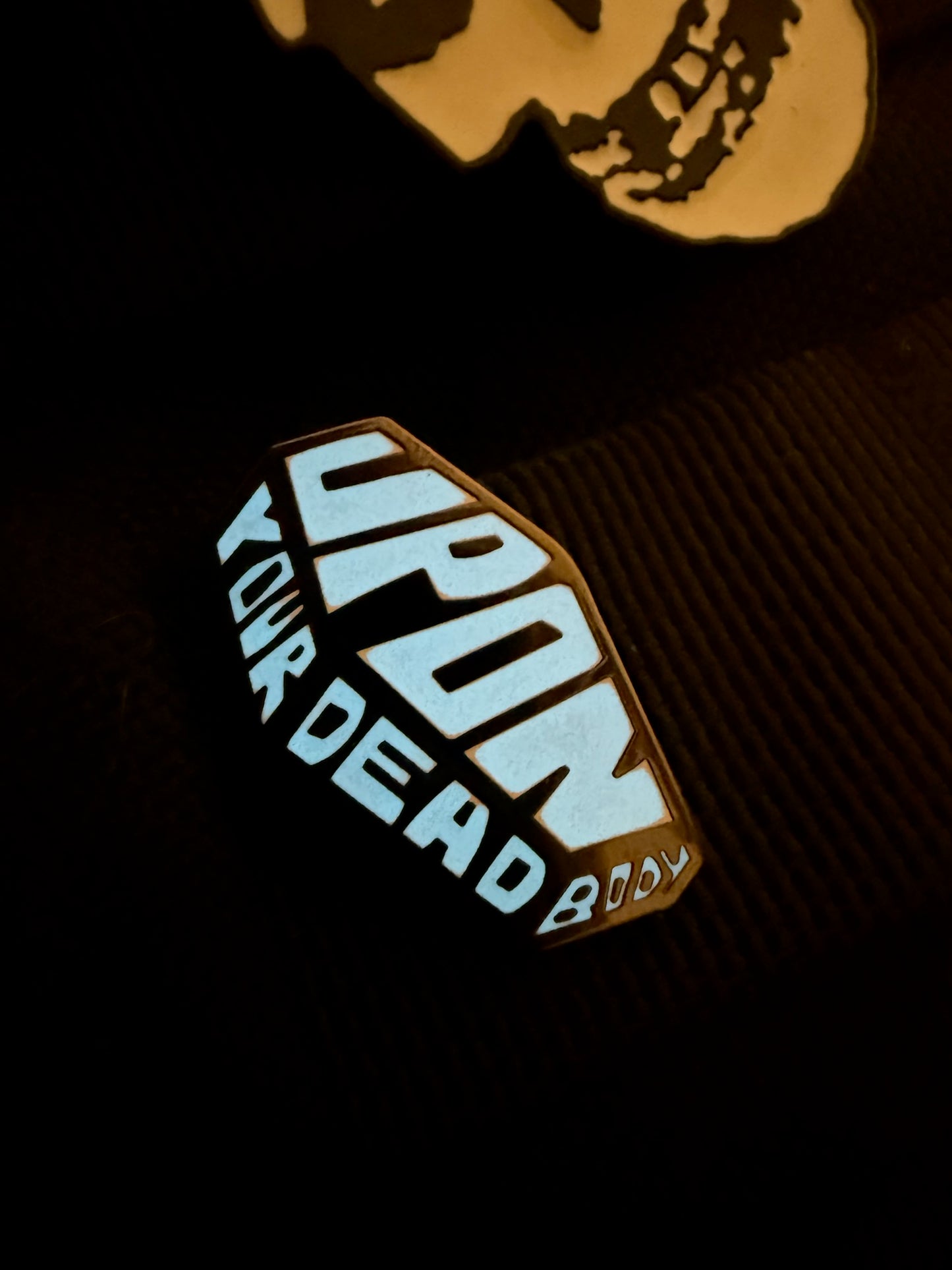 Upon Your Dead Body Coffin logo Glow in the Dark pin