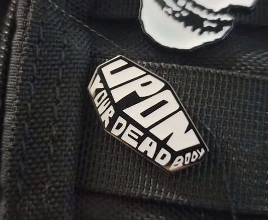 Upon Your Dead Body Coffin logo Glow in the Dark pin